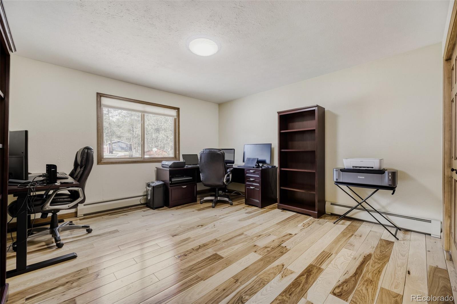 5000 Elizabeth Lane Evergreen, CO 80439 - Photo 18 of 30 a view of a workspace with furniture and a window