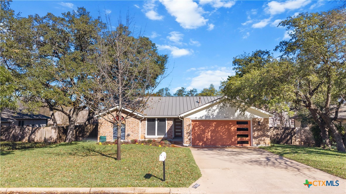 4504 Tamarack Trail Austin, TX 78727 - Photo 1 of 1 front view of a house with a yard