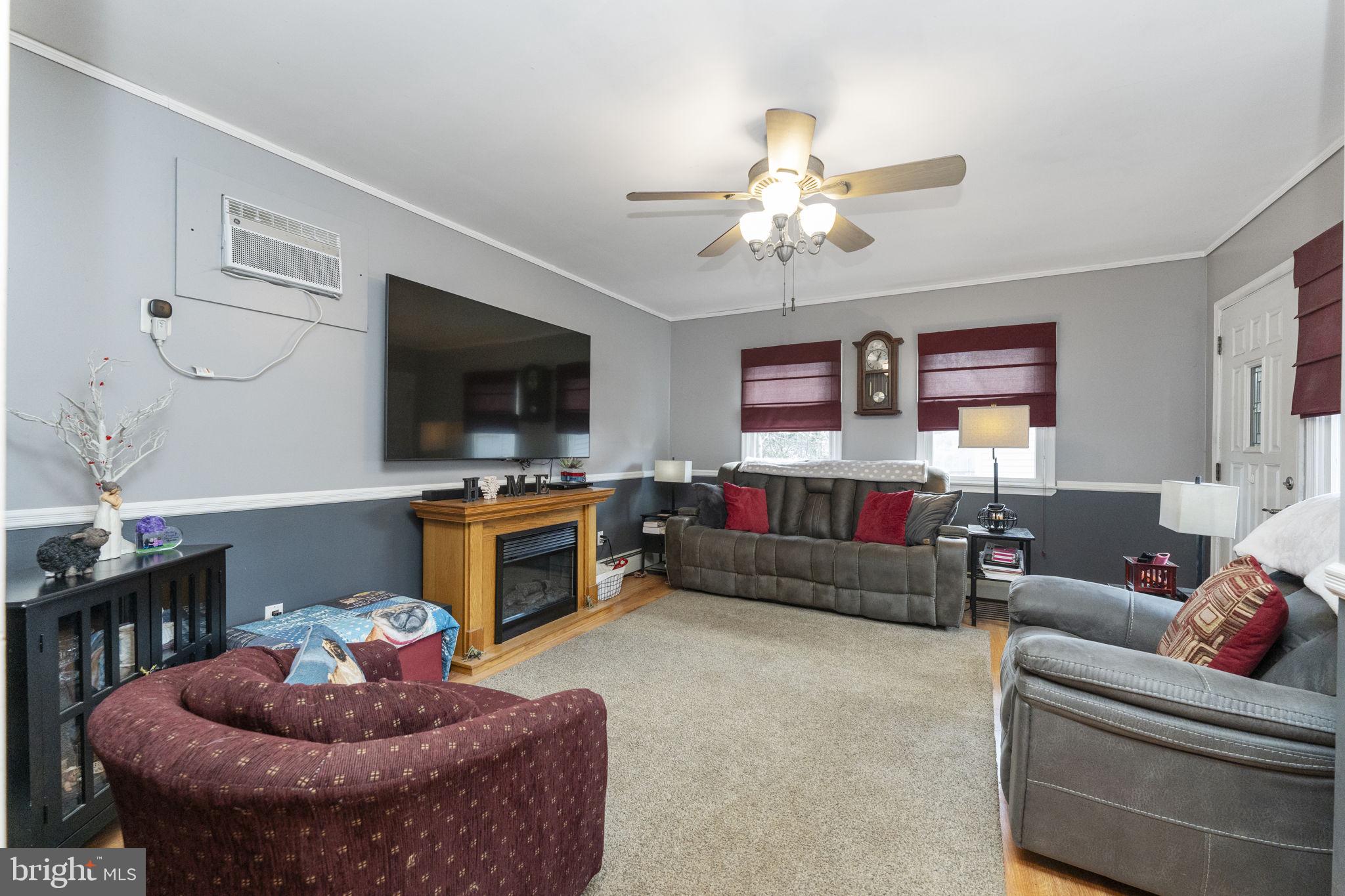 60 Inland Road Levittown, PA 19057 - Photo 15 of 32 a living room with furniture and a flat screen tv