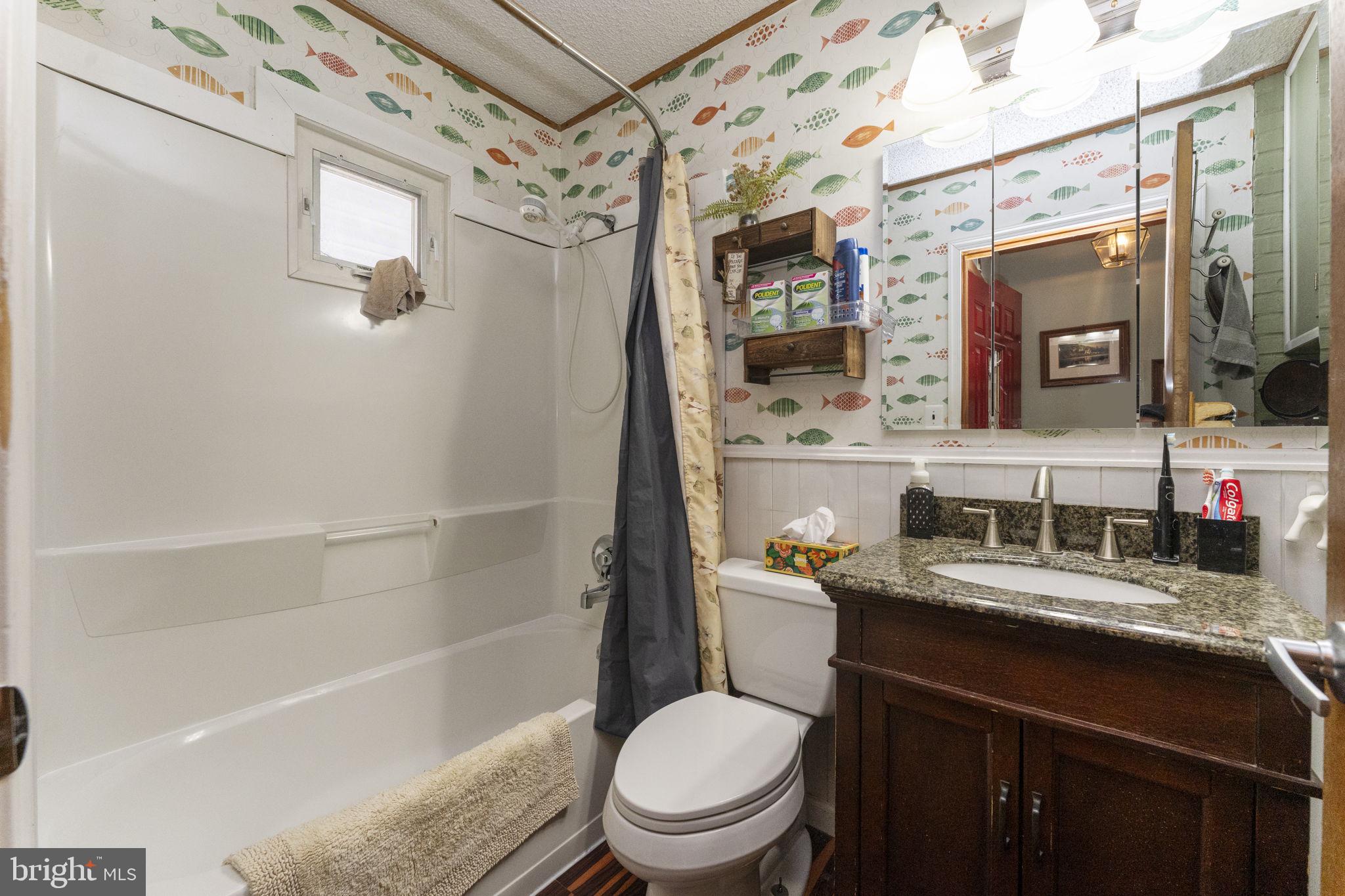 60 Inland Road Levittown, PA 19057 - Photo 17 of 32 a bathroom with a granite countertop sink toilet and shower