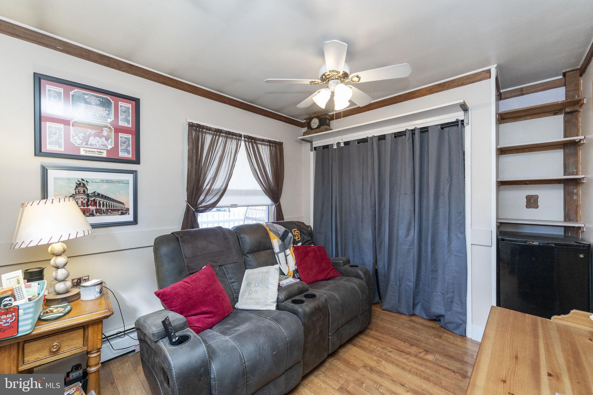 60 Inland Road Levittown, PA 19057 - Photo 23 of 32 a living room with furniture and a flat screen tv
