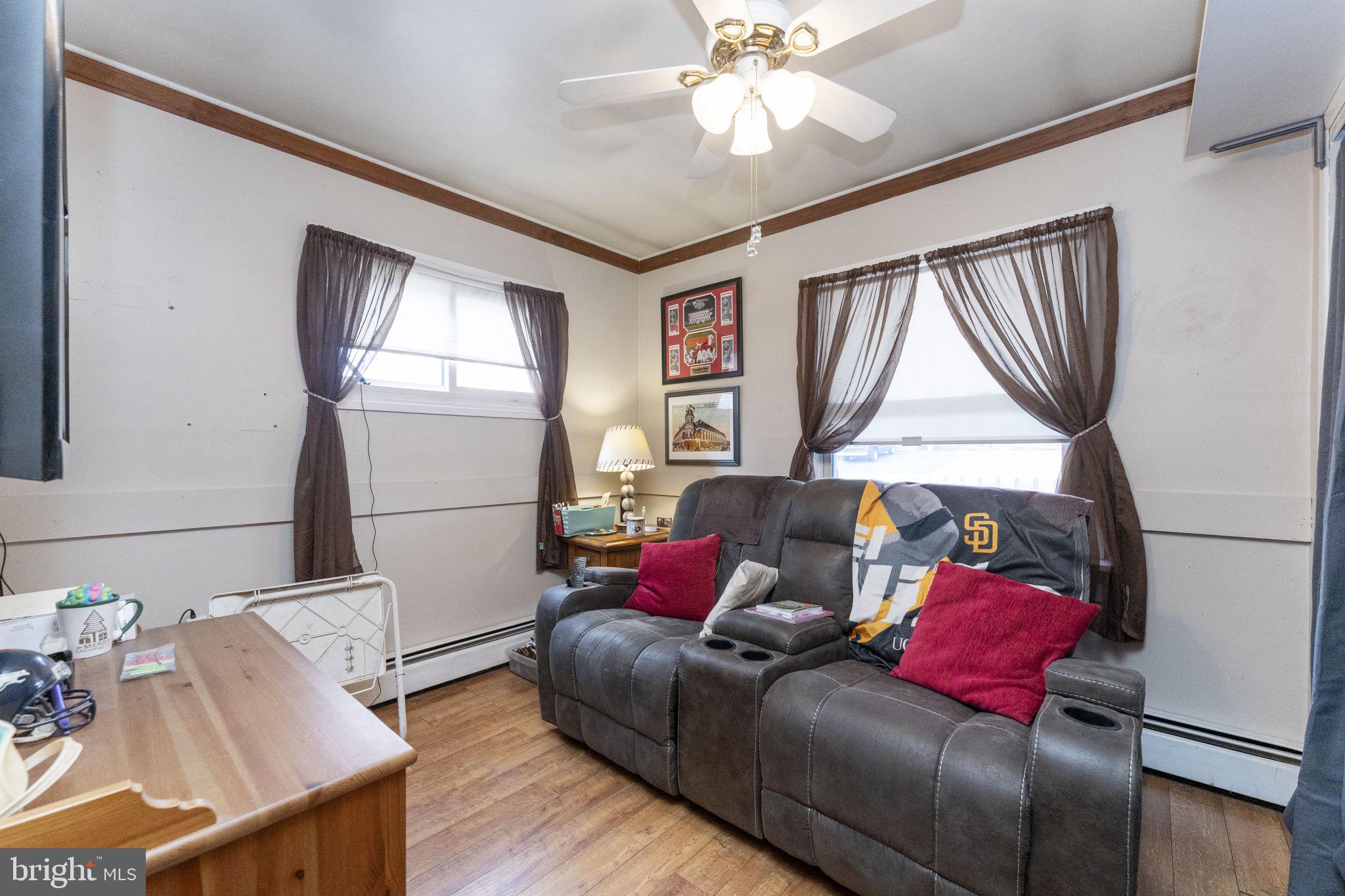 60 Inland Road Levittown, PA 19057 - Photo 24 of 32 a living room with furniture and a window