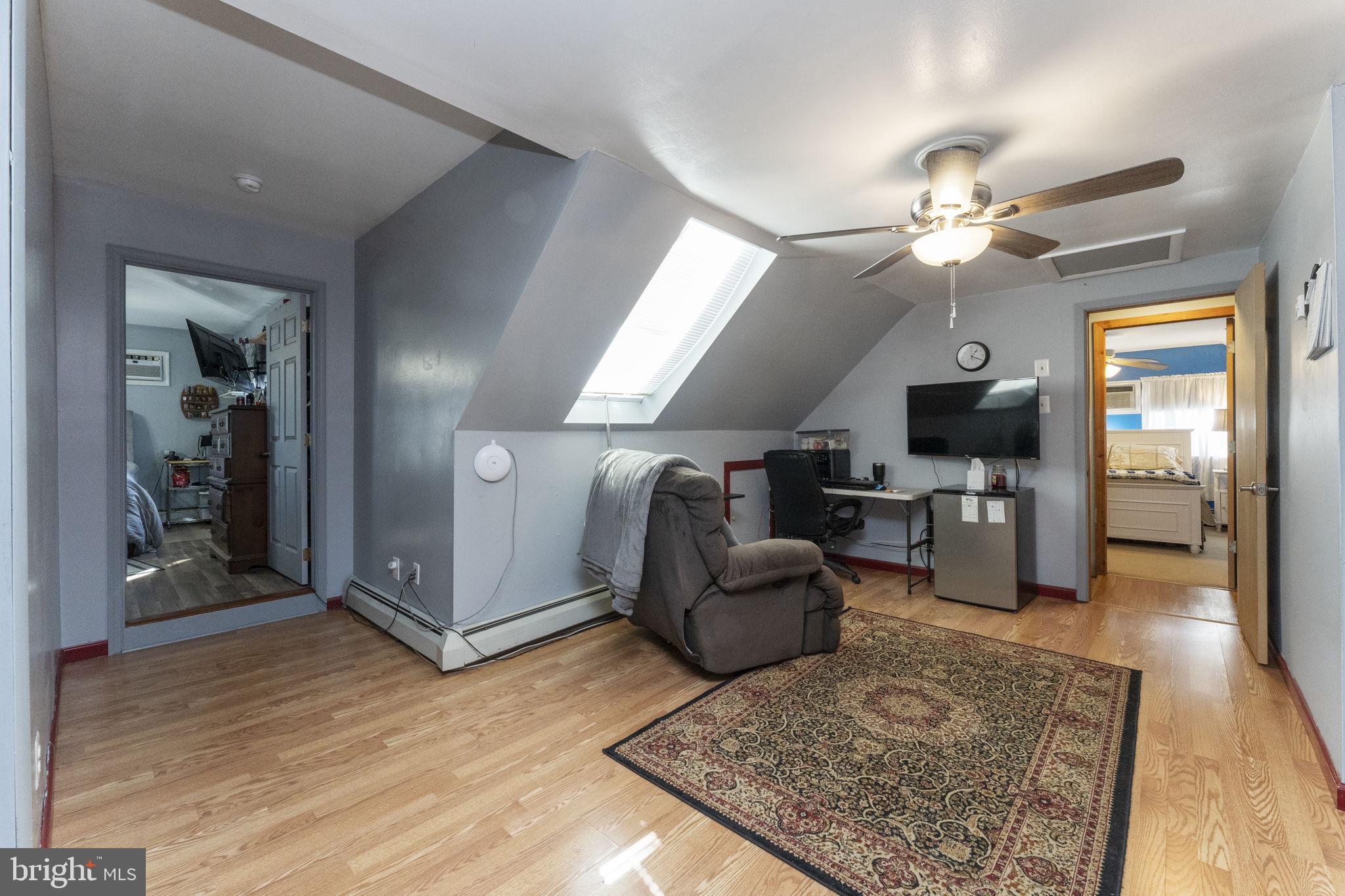 60 Inland Road Levittown, PA 19057 - Photo 25 of 32 a living room with furniture and a rug