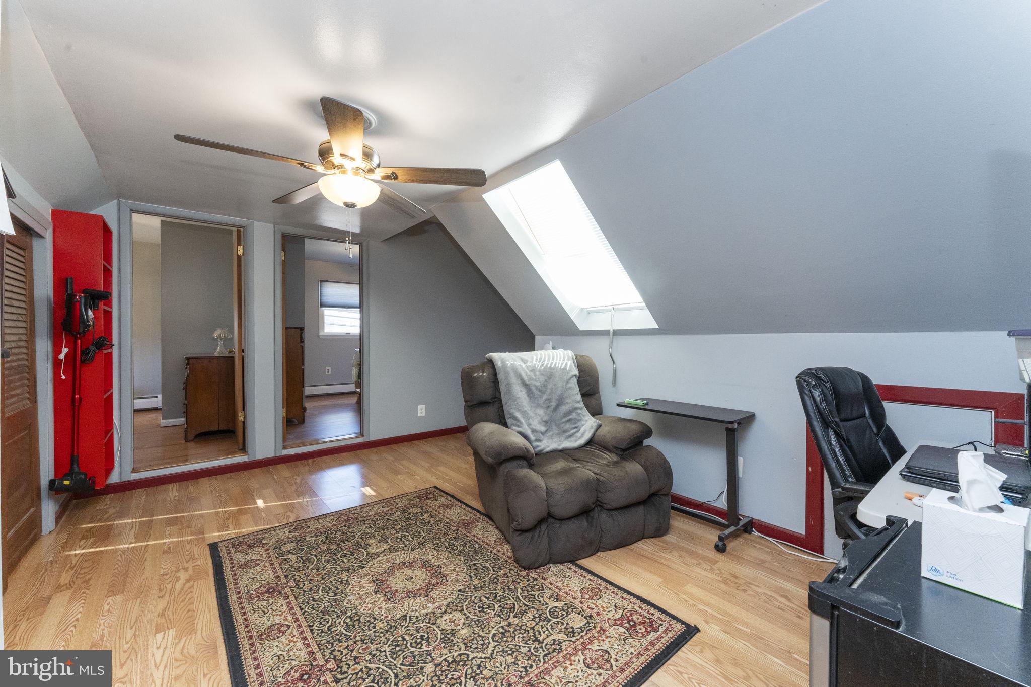 60 Inland Road Levittown, PA 19057 - Photo 26 of 32 a living room with furniture and wooden floor