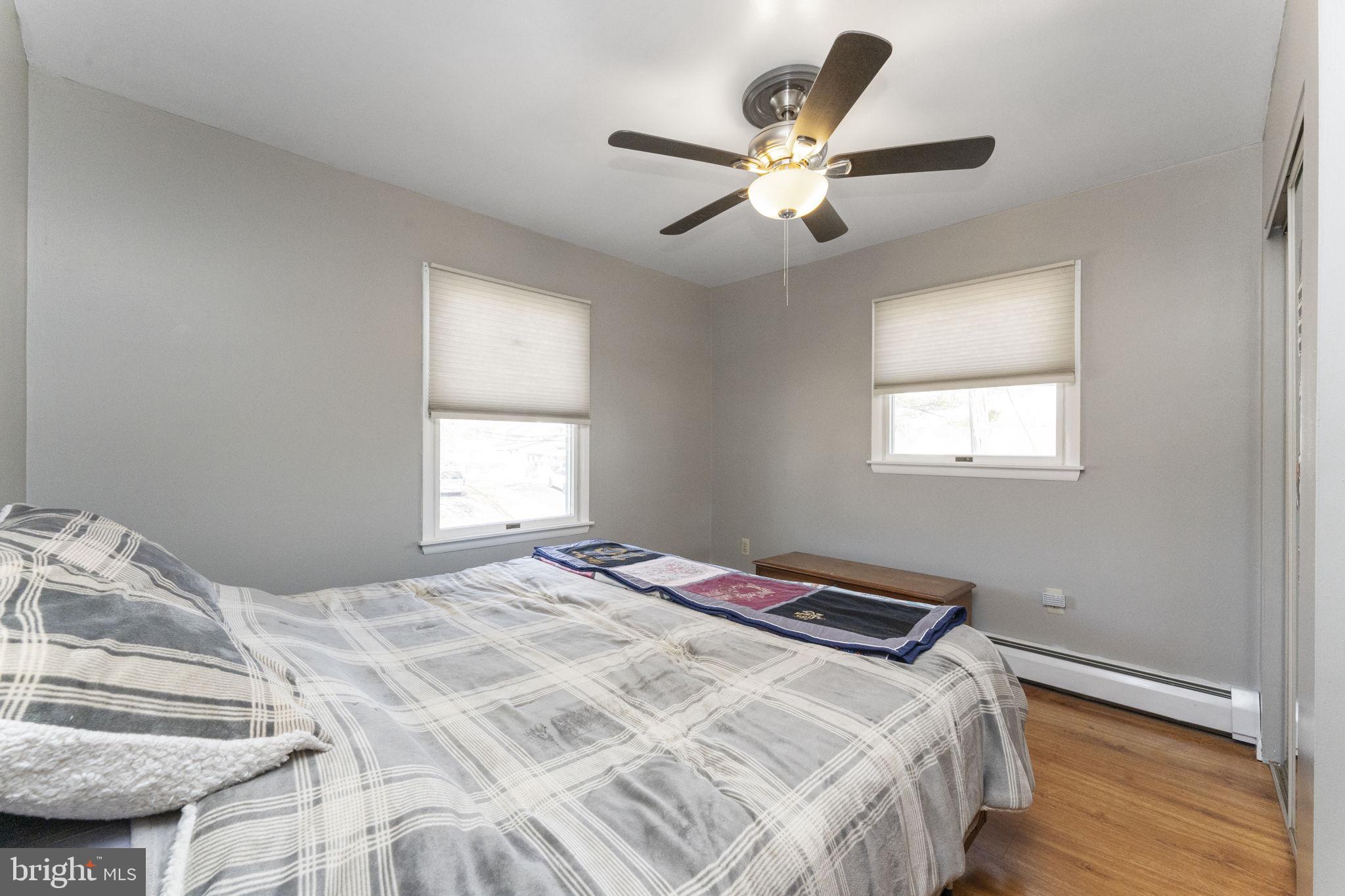 60 Inland Road Levittown, PA 19057 - Photo 28 of 32 a bedroom with a bed and a window