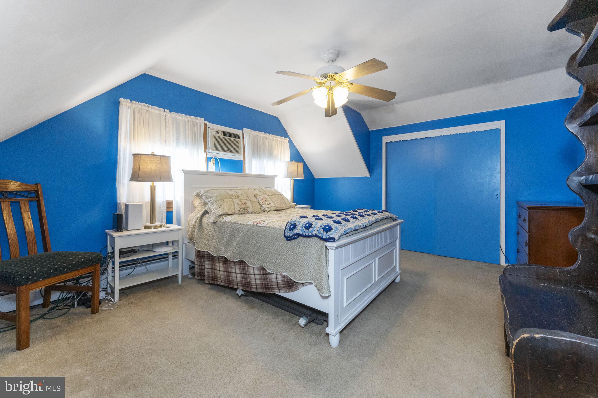 60 Inland Road Levittown, PA 19057 - Photo 30 of 32 a bedroom with a bed and a chandelier