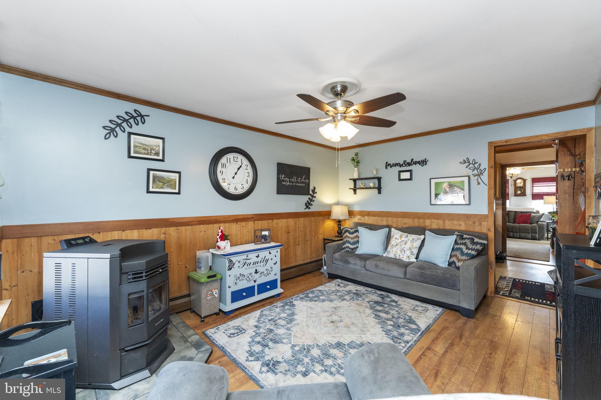 60 Inland Road Levittown, PA 19057 - Photo 5 of 32 a living room with furniture and a clock