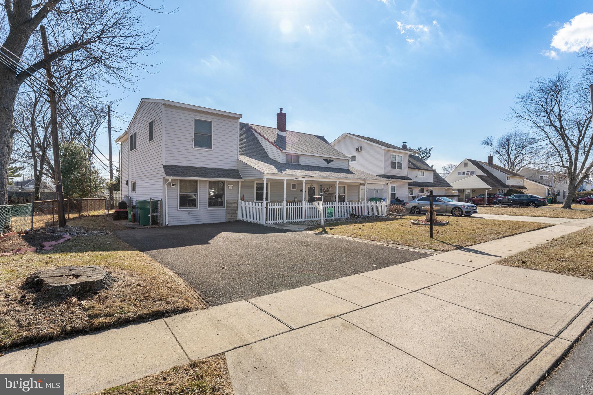 60 Inland Road Levittown, PA 19057 - Photo 6 of 32 a front view of a house with a yard