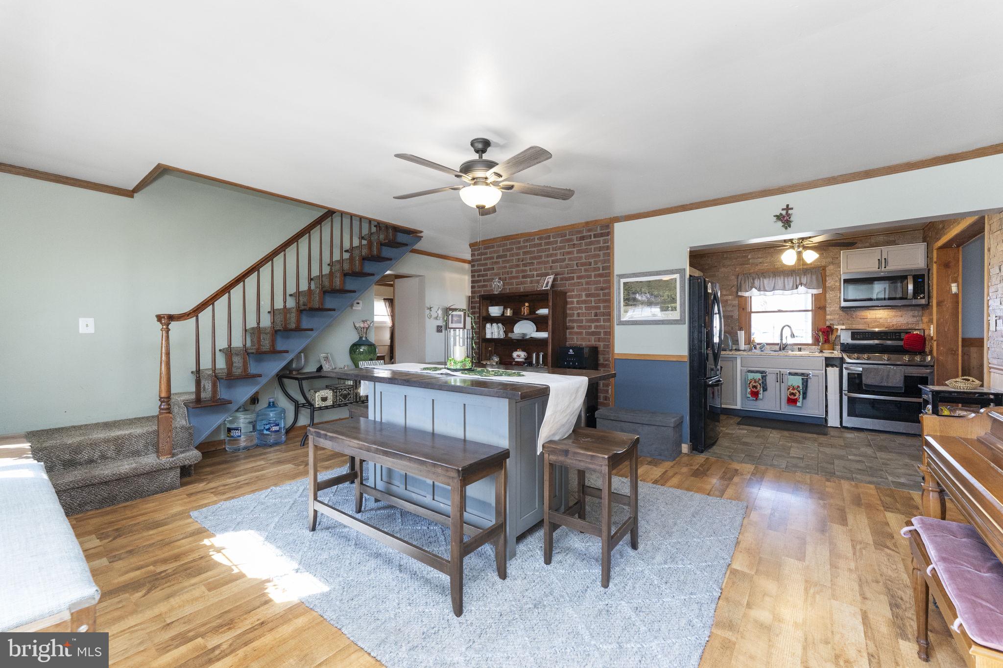 60 Inland Road Levittown, PA 19057 - Photo 10 of 32 a view of a livingroom with furniture and a ceiling fan