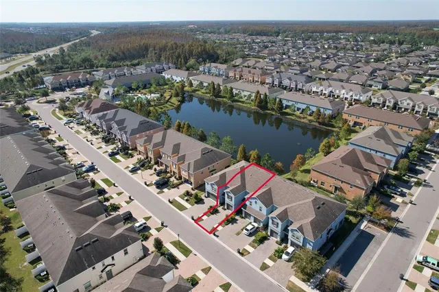 an aerial view of a house with a lake view