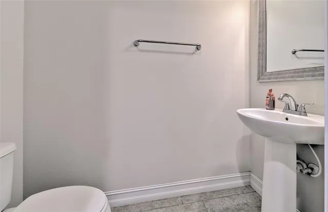 a bathroom with a sink a toilet