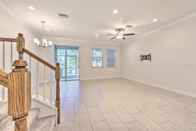a view of an entryway with a ceiling fan