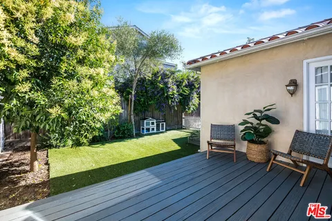 a backyard of a house with seating space