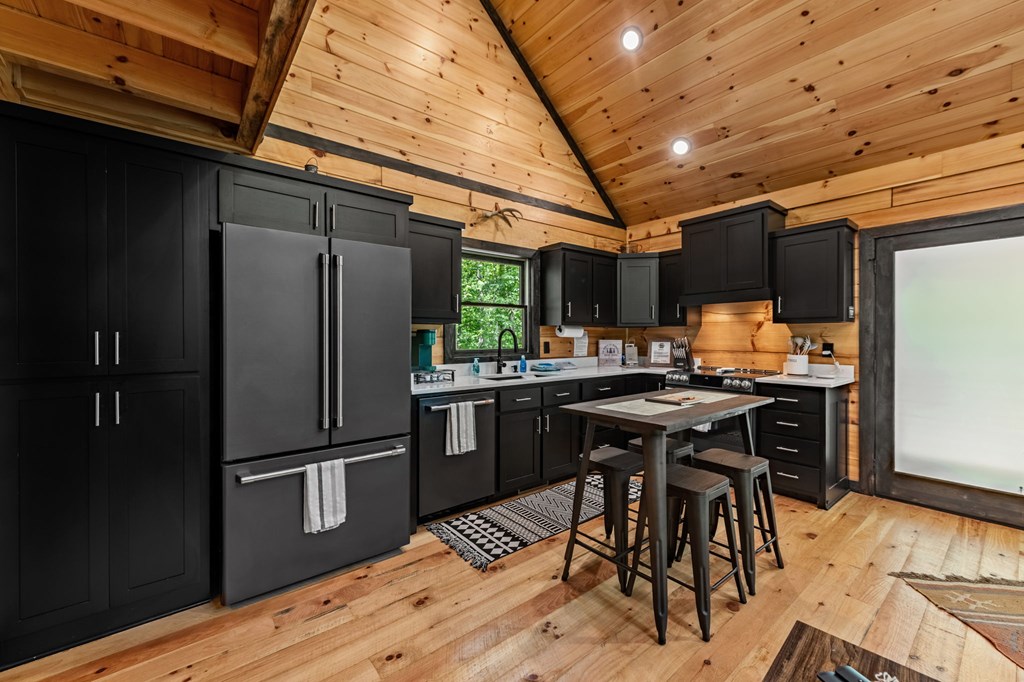 25 Hidden Ridge Cherry Log, GA 30522 - Photo 31 of 52 a kitchen with granite countertop a refrigerator and a stove top oven