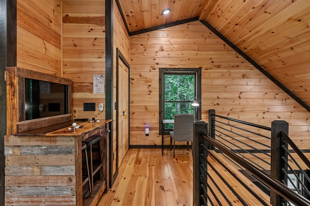 25 Hidden Ridge Cherry Log, GA 30522 - Photo 45 of 52 a view of a balcony with chairs and wooden floor