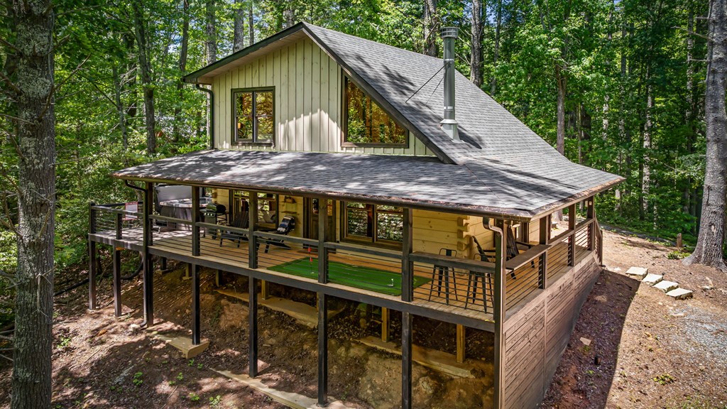 25 Hidden Ridge Cherry Log, GA 30522 - Photo 6 of 52 a view of house with wooden fence and a shade