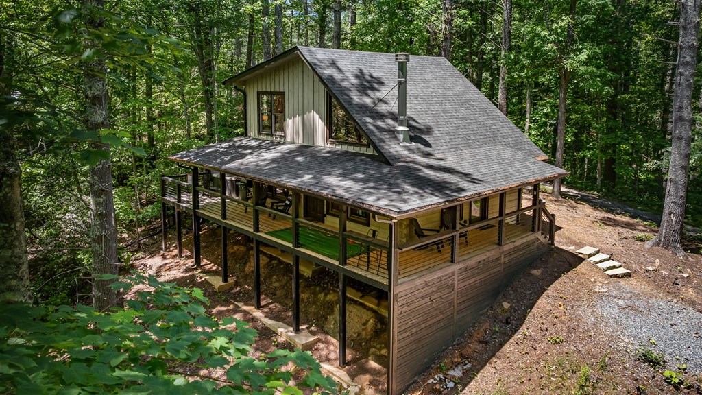 25 Hidden Ridge Cherry Log, GA 30522 - Photo 8 of 52 a roof deck with wooden floor and yard in the back