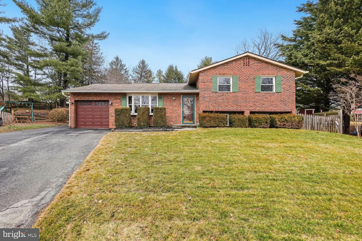 24357 Flamingo Terrace Gaithersburg, MD 20882 - Photo 1 of 41 a front view of a house with a yard