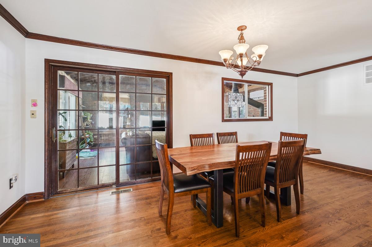 24357 Flamingo Terrace Gaithersburg, MD 20882 - Photo 19 of 41 a view of a dining room with furniture window and wooden floor