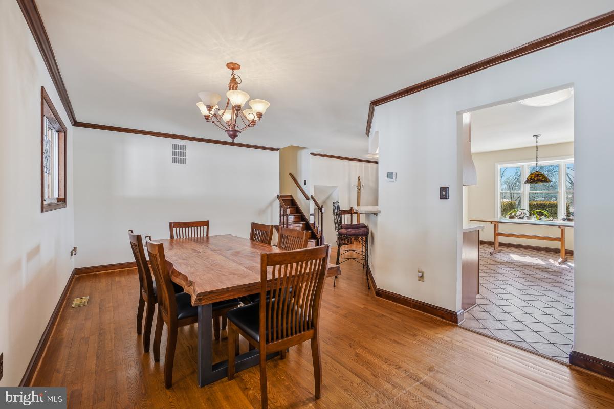 24357 Flamingo Terrace Gaithersburg, MD 20882 - Photo 20 of 41 a view of a dining room with furniture and wooden floor