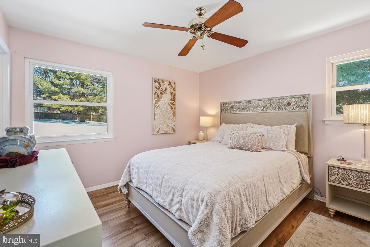 24357 Flamingo Terrace Gaithersburg, MD 20882 - Photo 26 of 41 a bedroom with a bed a dresser next to a window