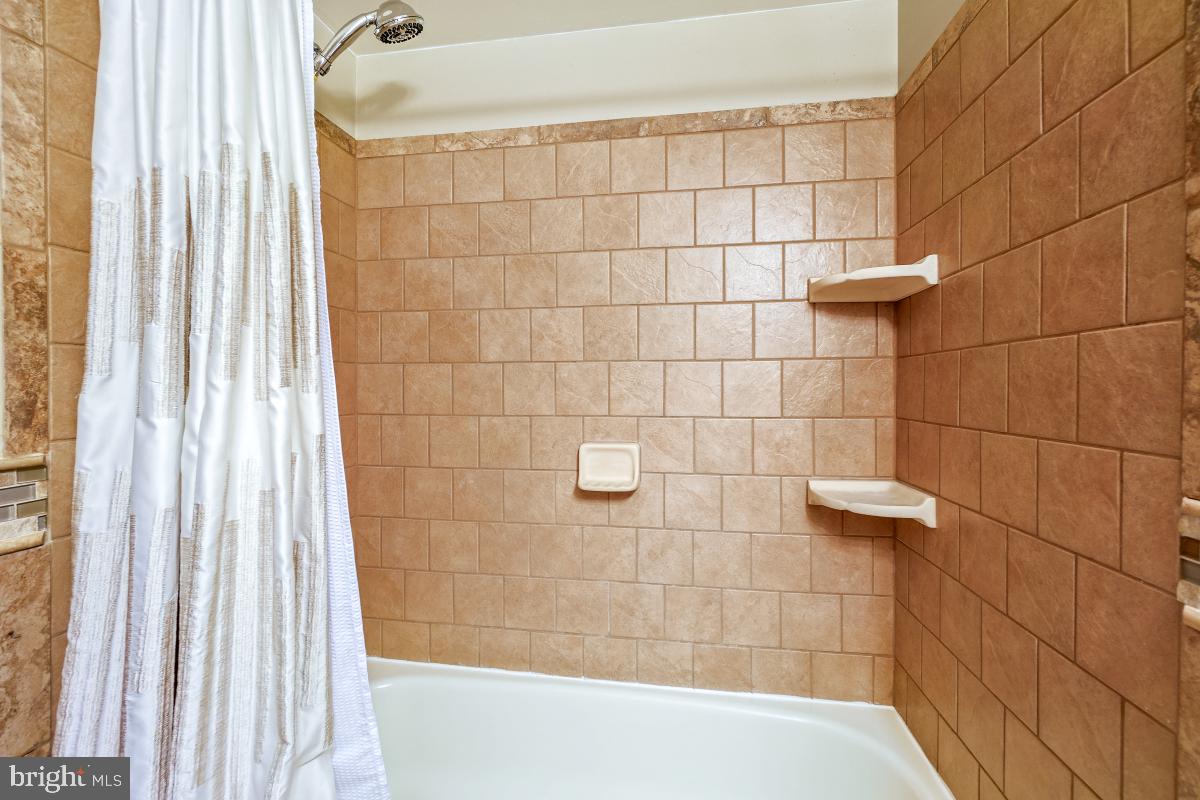 24357 Flamingo Terrace Gaithersburg, MD 20882 - Photo 31 of 41 a bathroom with a shower