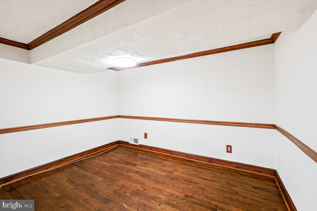 24357 Flamingo Terrace Gaithersburg, MD 20882 - Photo 38 of 41 a view of a room with wooden floor