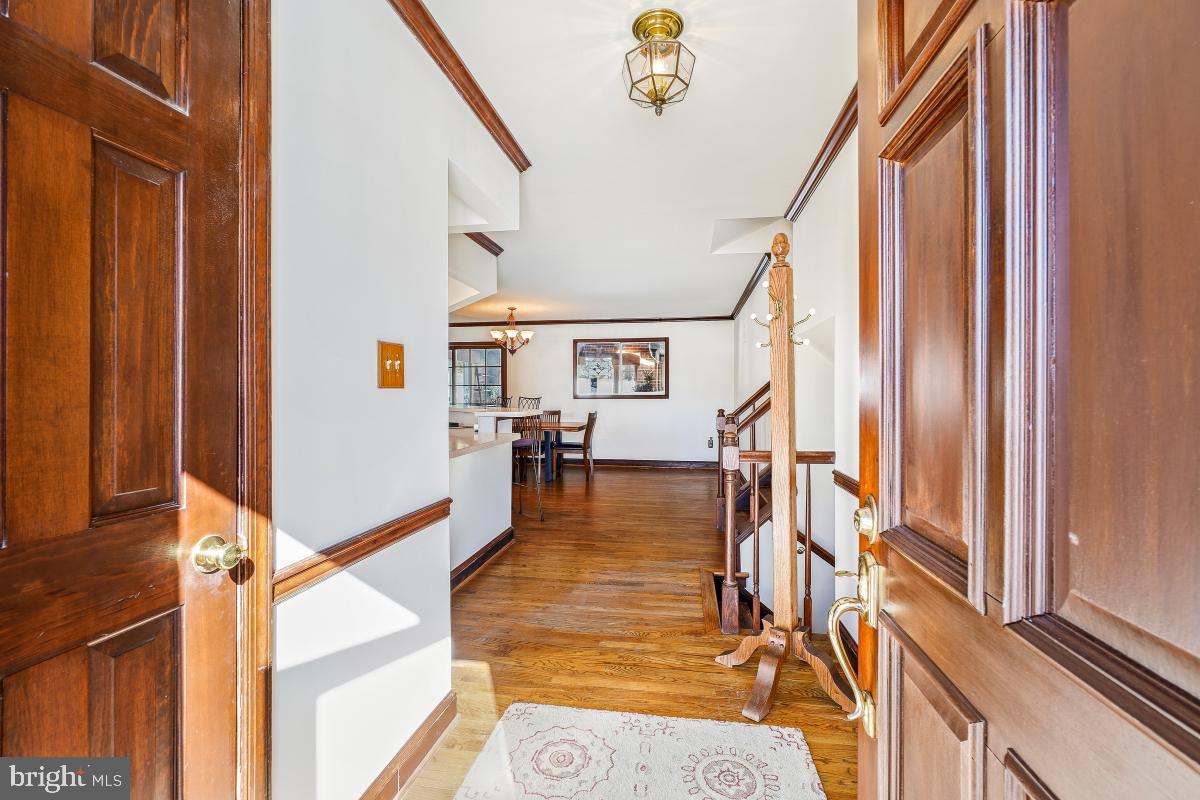 24357 Flamingo Terrace Gaithersburg, MD 20882 - Photo 7 of 41 a view of entryway and hall with wooden floor