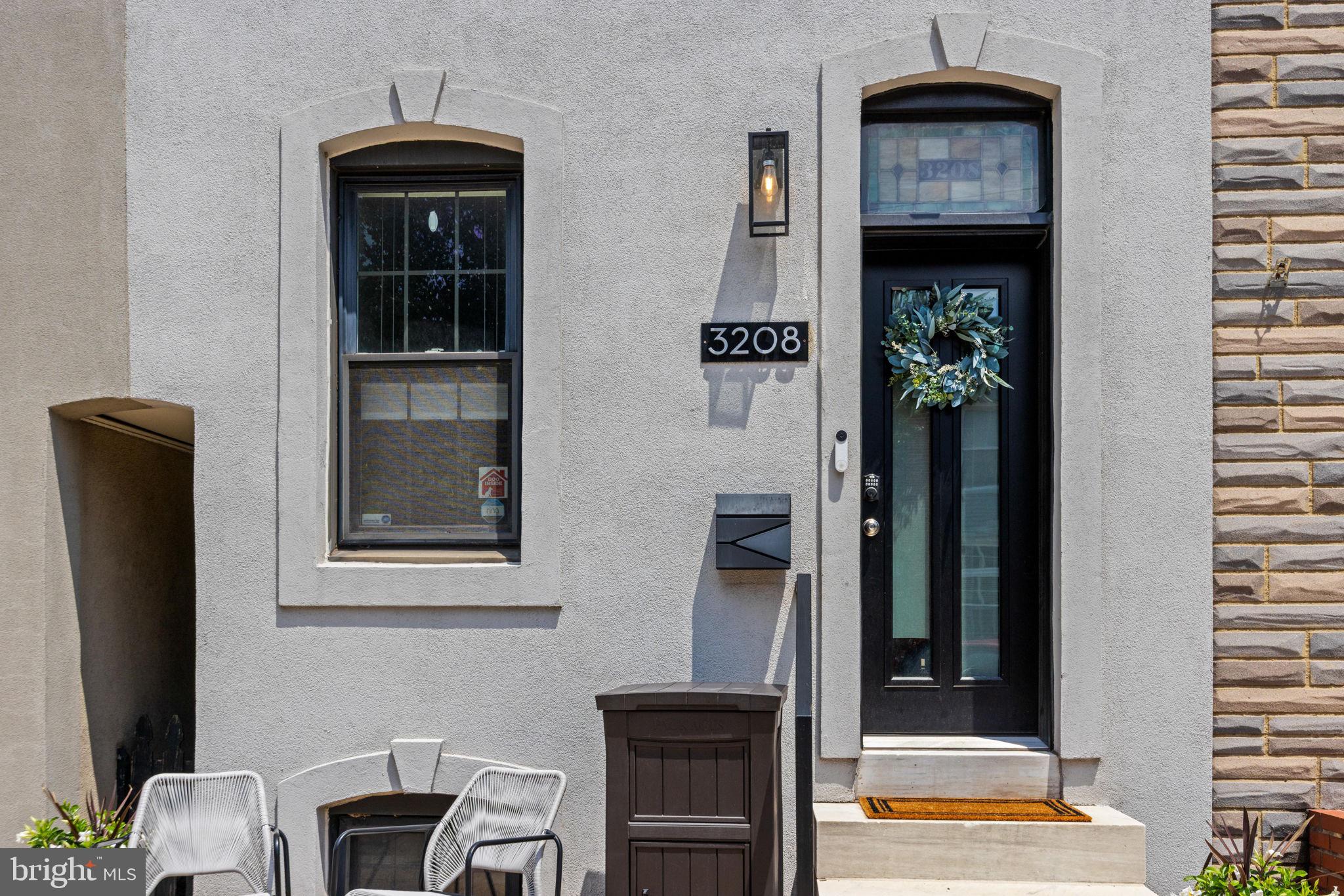 3208 Elliott Street Baltimore, MD 21224 - Photo 42 of 42 a front view of a house with entryway and windows