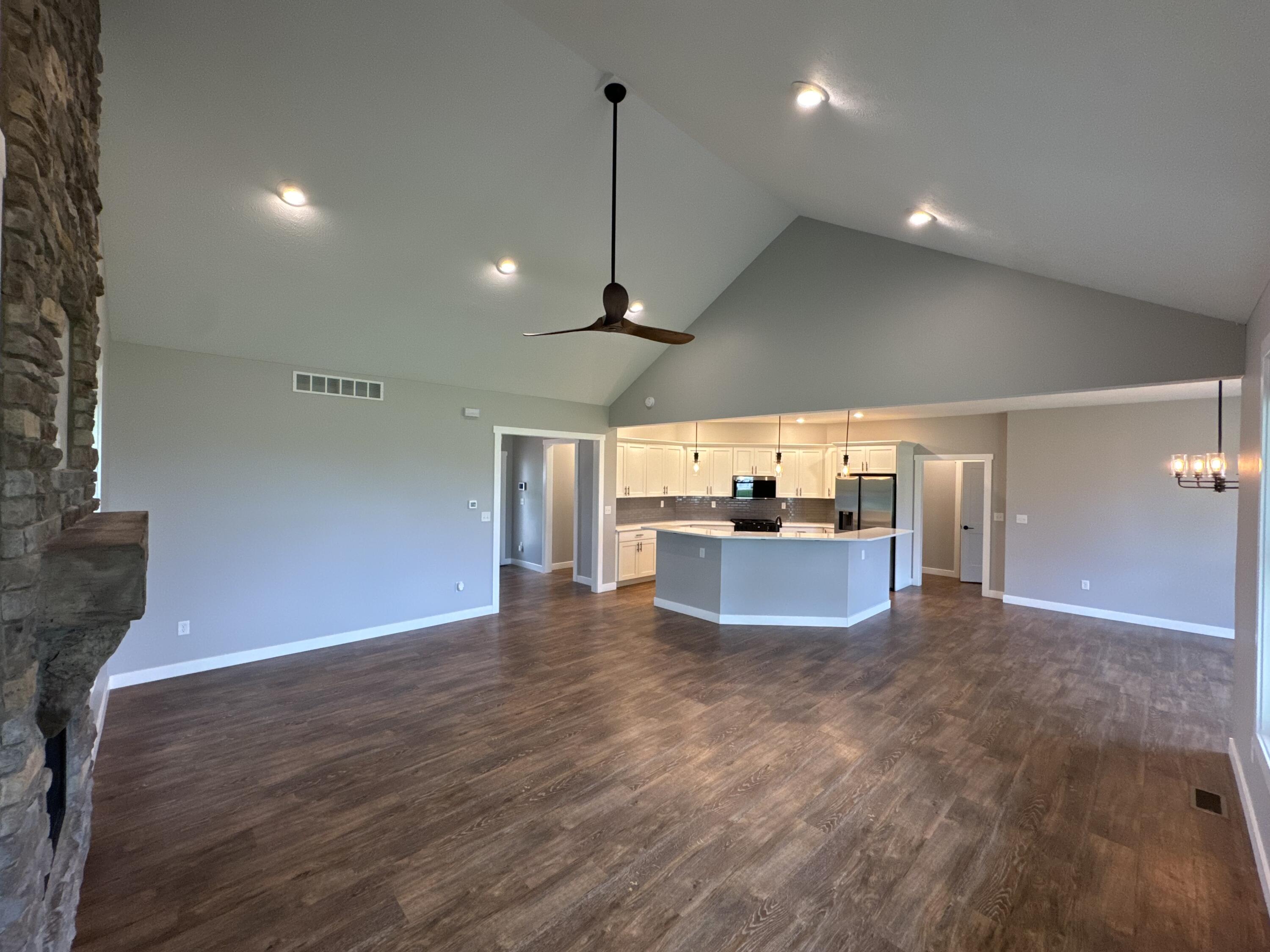 20009 Weber Lane Goshen, IN 46528 - Photo 5 of 17 a view of a big room with wooden floor and windows