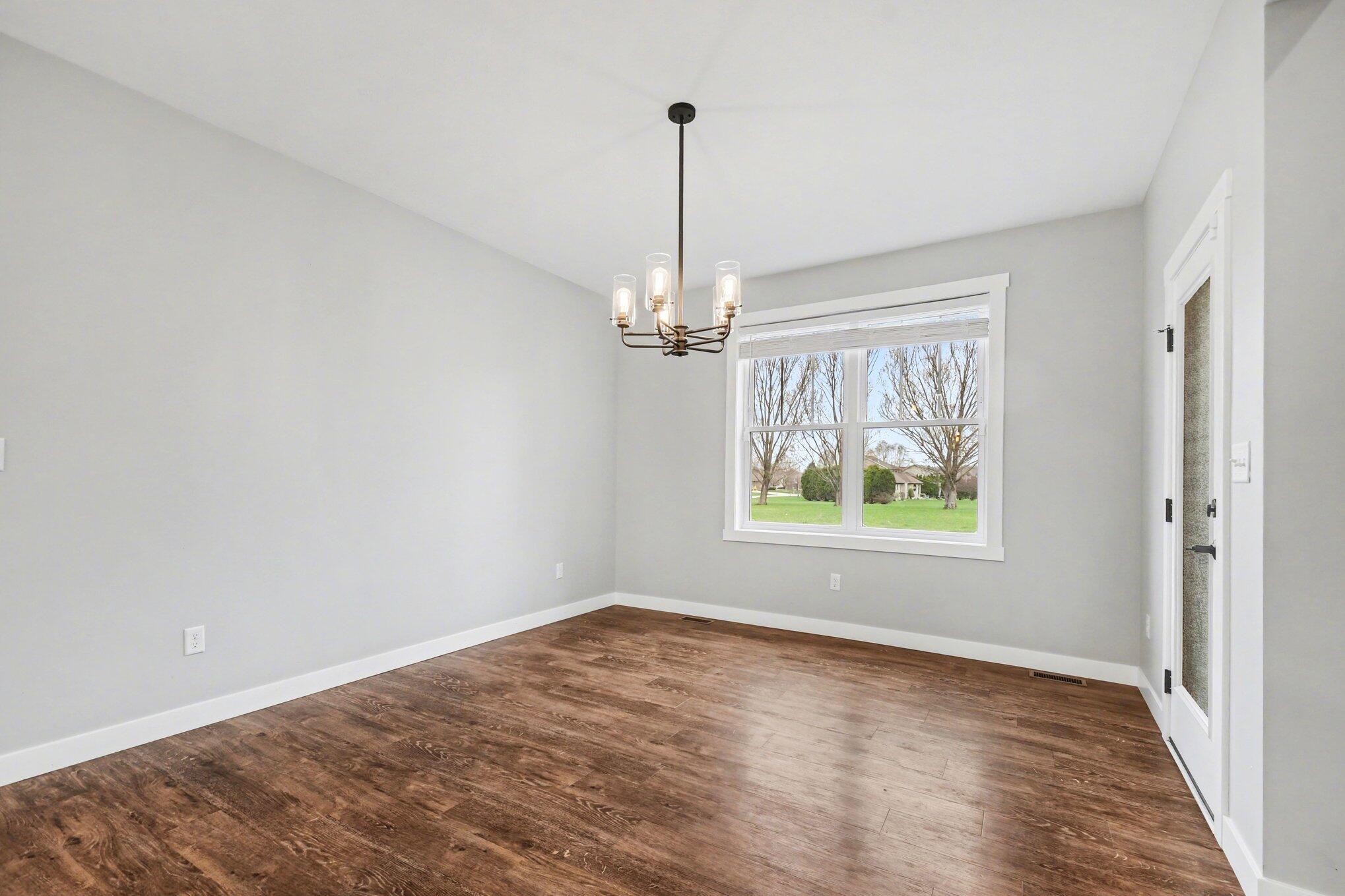 20009 Weber Lane Goshen, IN 46528 - Photo 6 of 17 an empty room with windows and outdoor space
