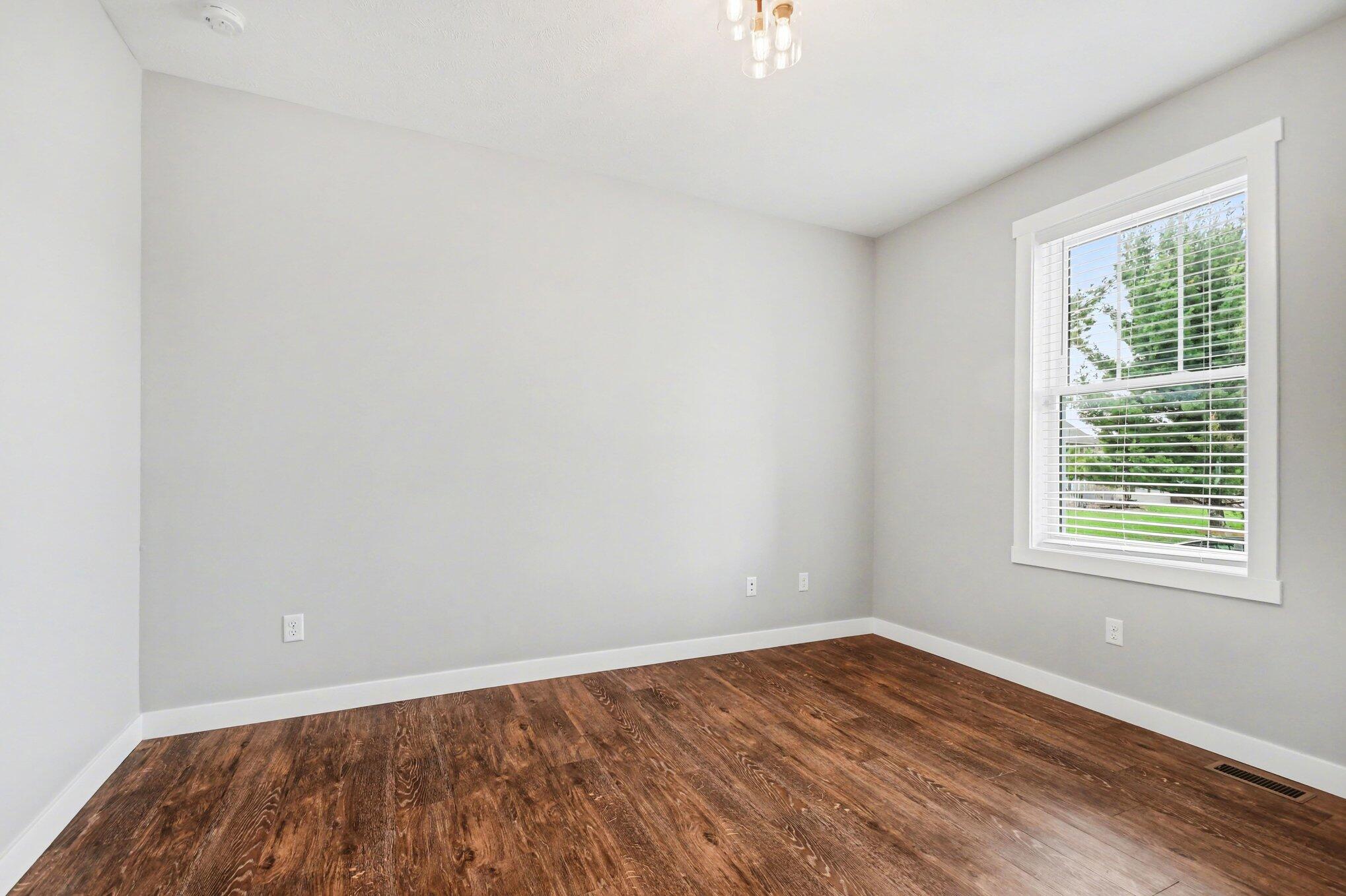 20009 Weber Lane Goshen, IN 46528 - Photo 8 of 17 wooden floor in an empty room with a window