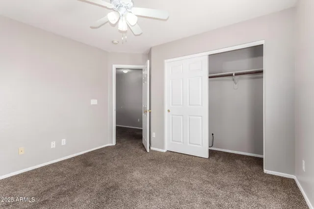 a bathroom with a sink a toilet and a large mirror