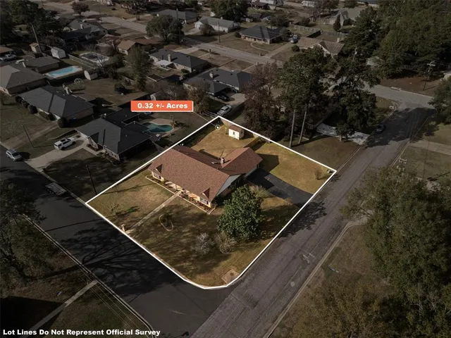 an aerial view of house with yard