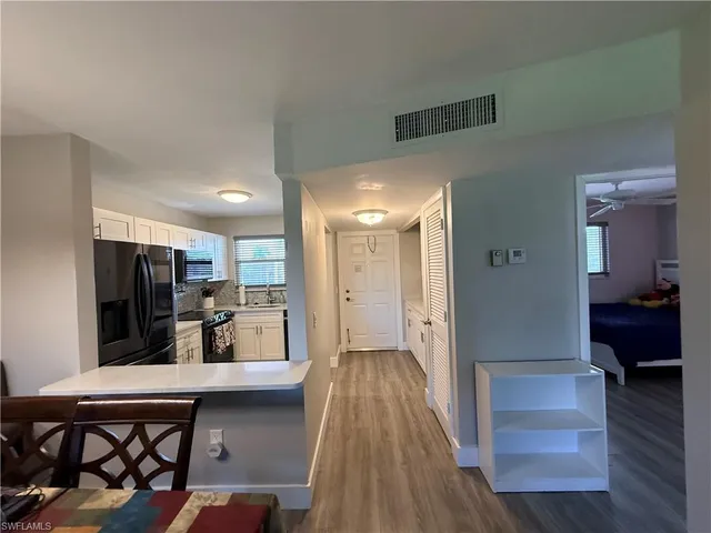 a kitchen with a refrigerator sink and stove