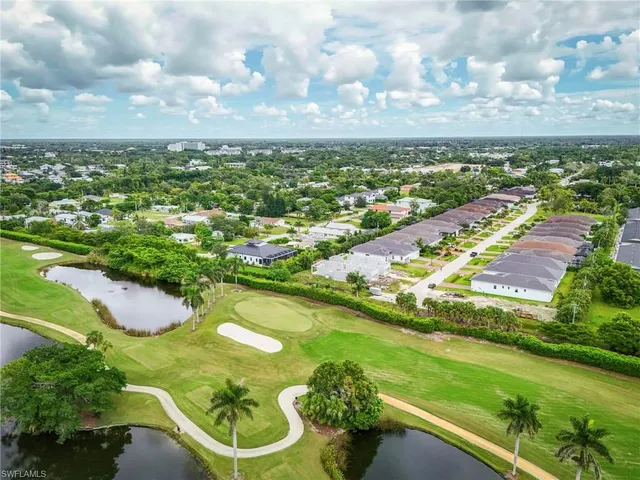 an aerial view of residential building and lake