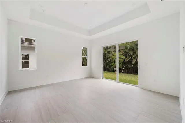 a white bath tub sitting next to a shower