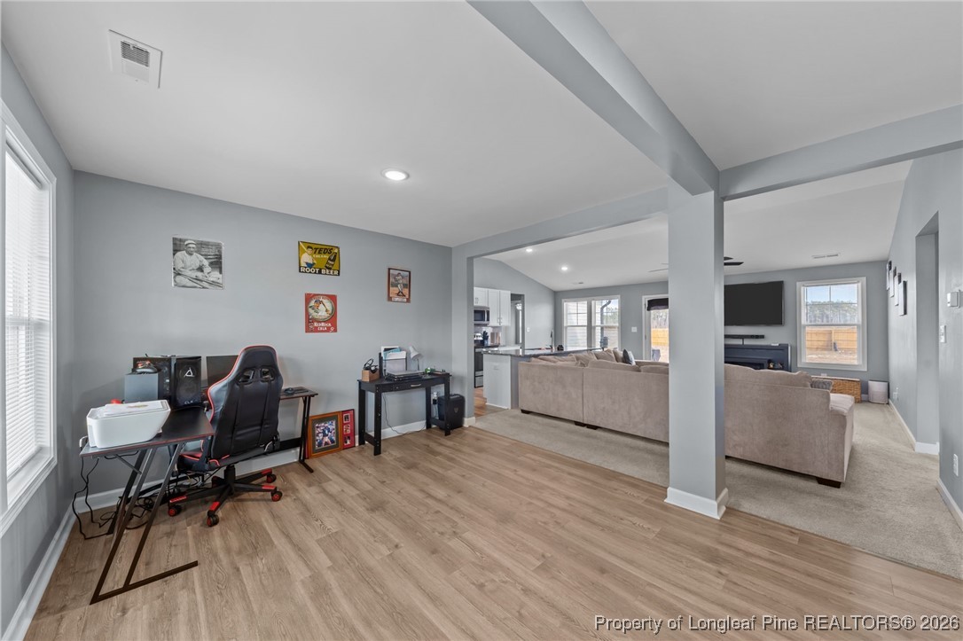 522 Carolina Church Road St. Pauls, NC 28384 - Photo 15 of 36 a living room with furniture and a wooden floor