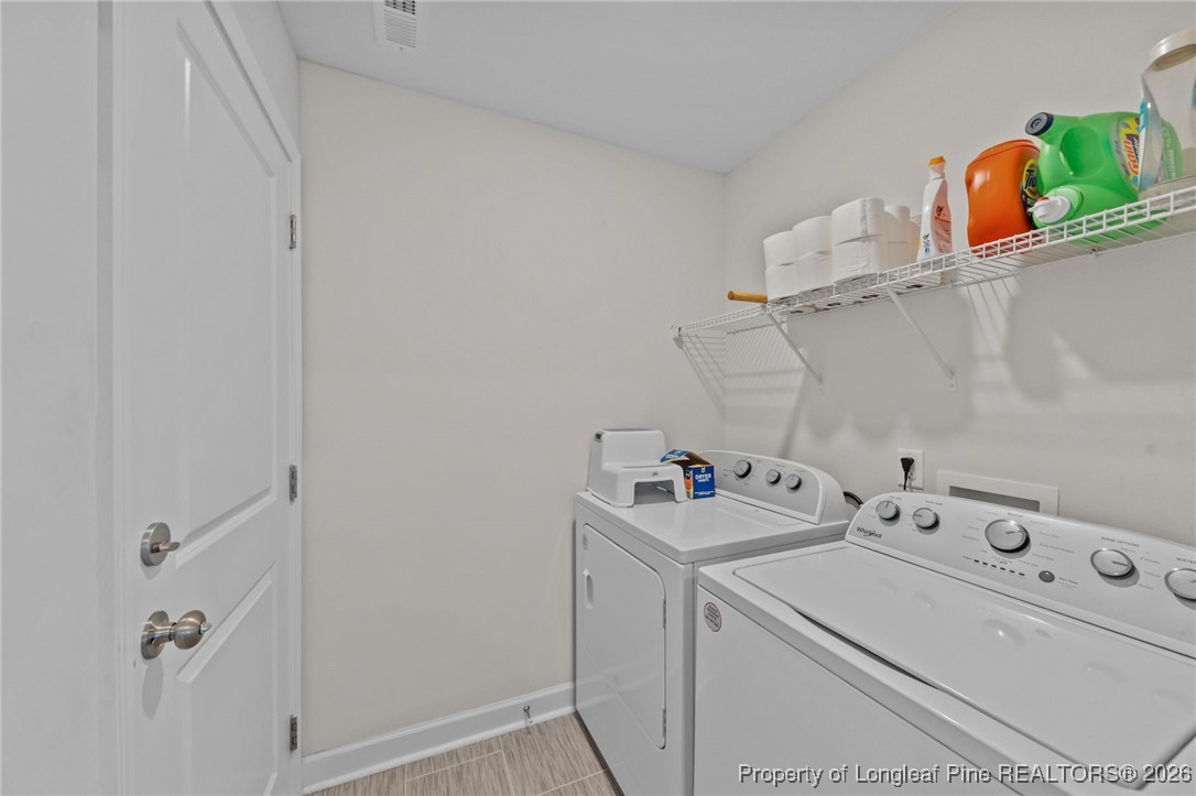 522 Carolina Church Road St. Pauls, NC 28384 - Photo 17 of 36 a utility room with dryer and washer