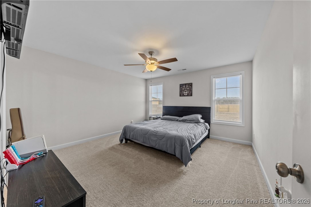 522 Carolina Church Road St. Pauls, NC 28384 - Photo 22 of 36 a bedroom with a bed and a window