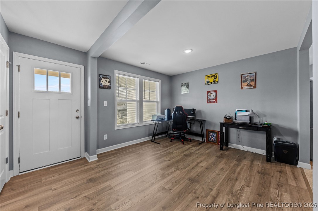 522 Carolina Church Road St. Pauls, NC 28384 - Photo 26 of 36 a living room with furniture and a wooden floor