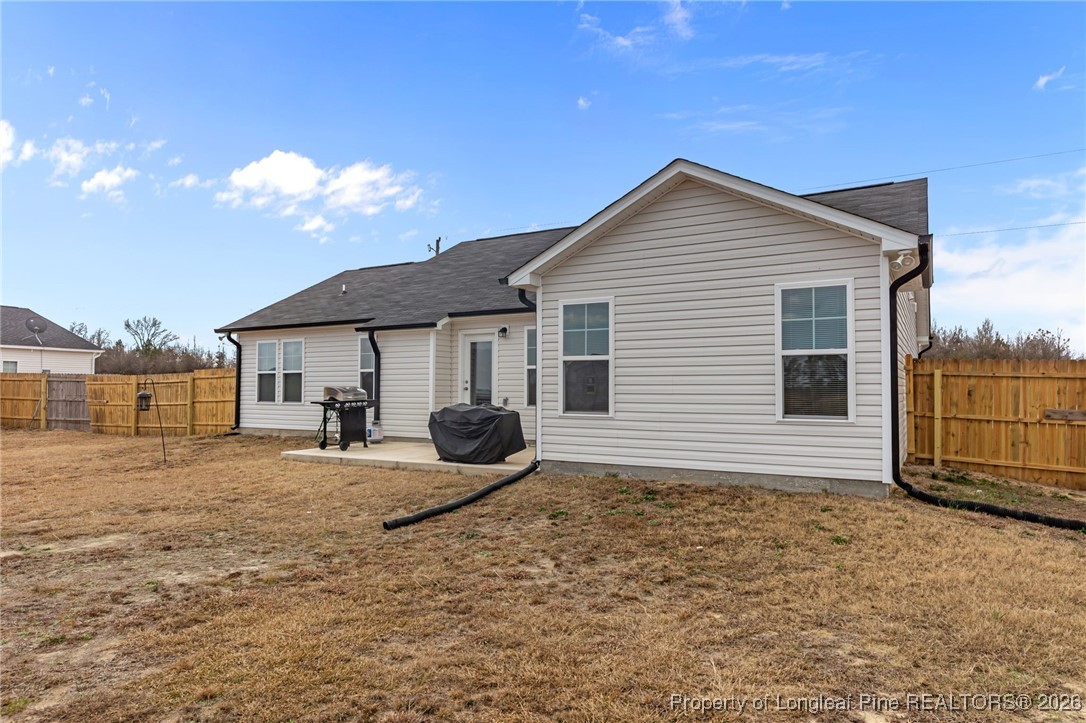 522 Carolina Church Road St. Pauls, NC 28384 - Photo 30 of 36 a house view with a backyard space