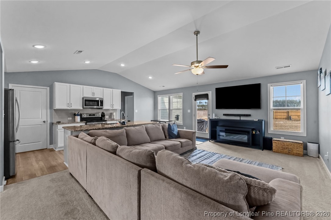 522 Carolina Church Road St. Pauls, NC 28384 - Photo 3 of 36 a living room with furniture and a flat screen tv