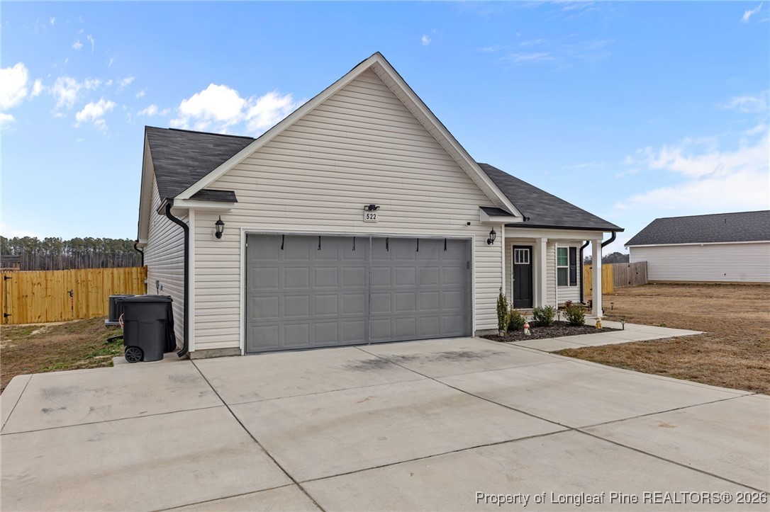 522 Carolina Church Road St. Pauls, NC 28384 - Photo 33 of 36 a front view of a house with a garage