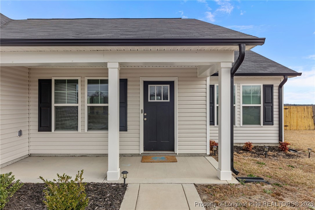 522 Carolina Church Road St. Pauls, NC 28384 - Photo 5 of 36 a front view of a house with a porch