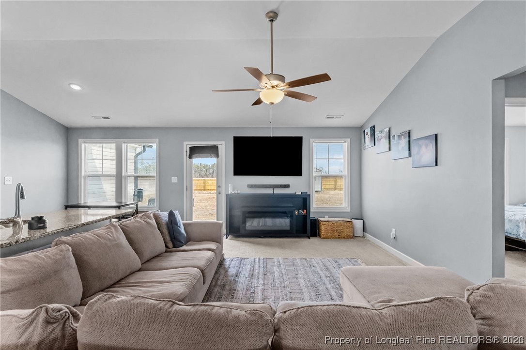 522 Carolina Church Road St. Pauls, NC 28384 - Photo 6 of 36 a living room with furniture and a flat screen tv