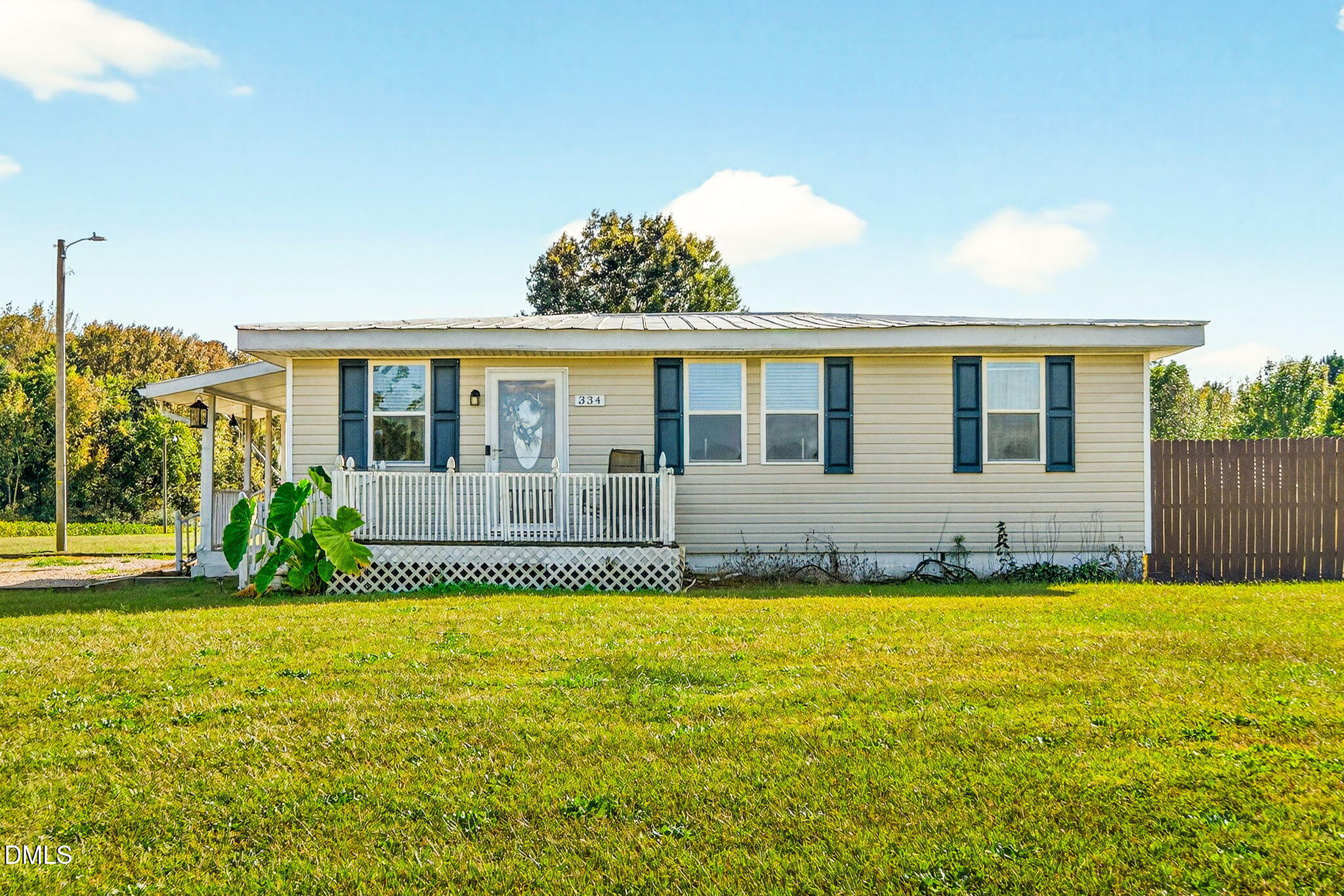 334 Perry Curtis Road Zebulon, NC 27597 - Photo 1 of 38 a house view with swimming pool in front of it