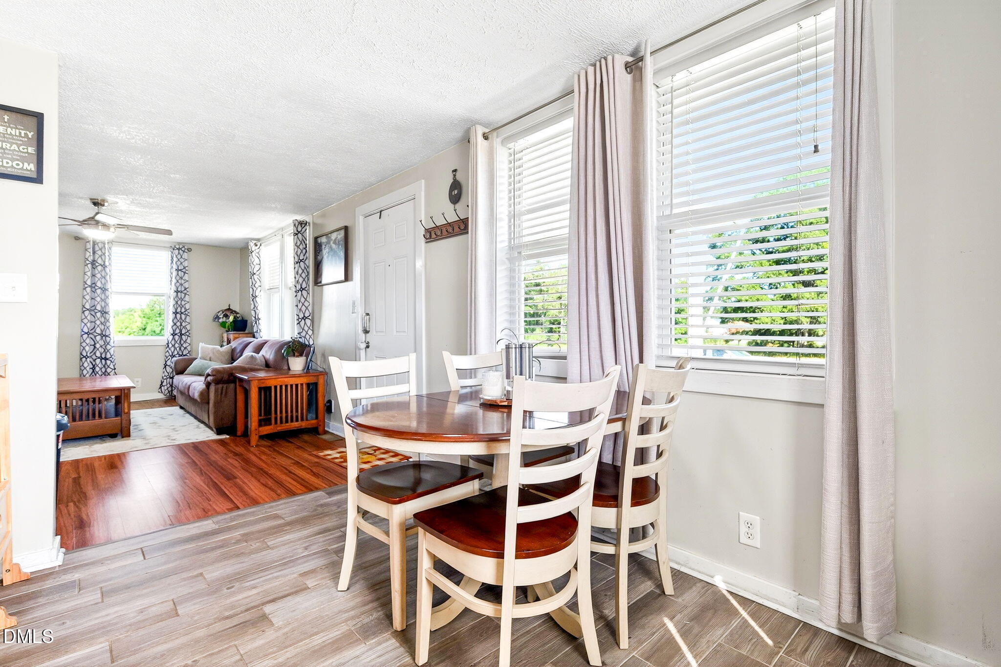 334 Perry Curtis Road Zebulon, NC 27597 - Photo 15 of 38 a dining room with wooden floor and large window