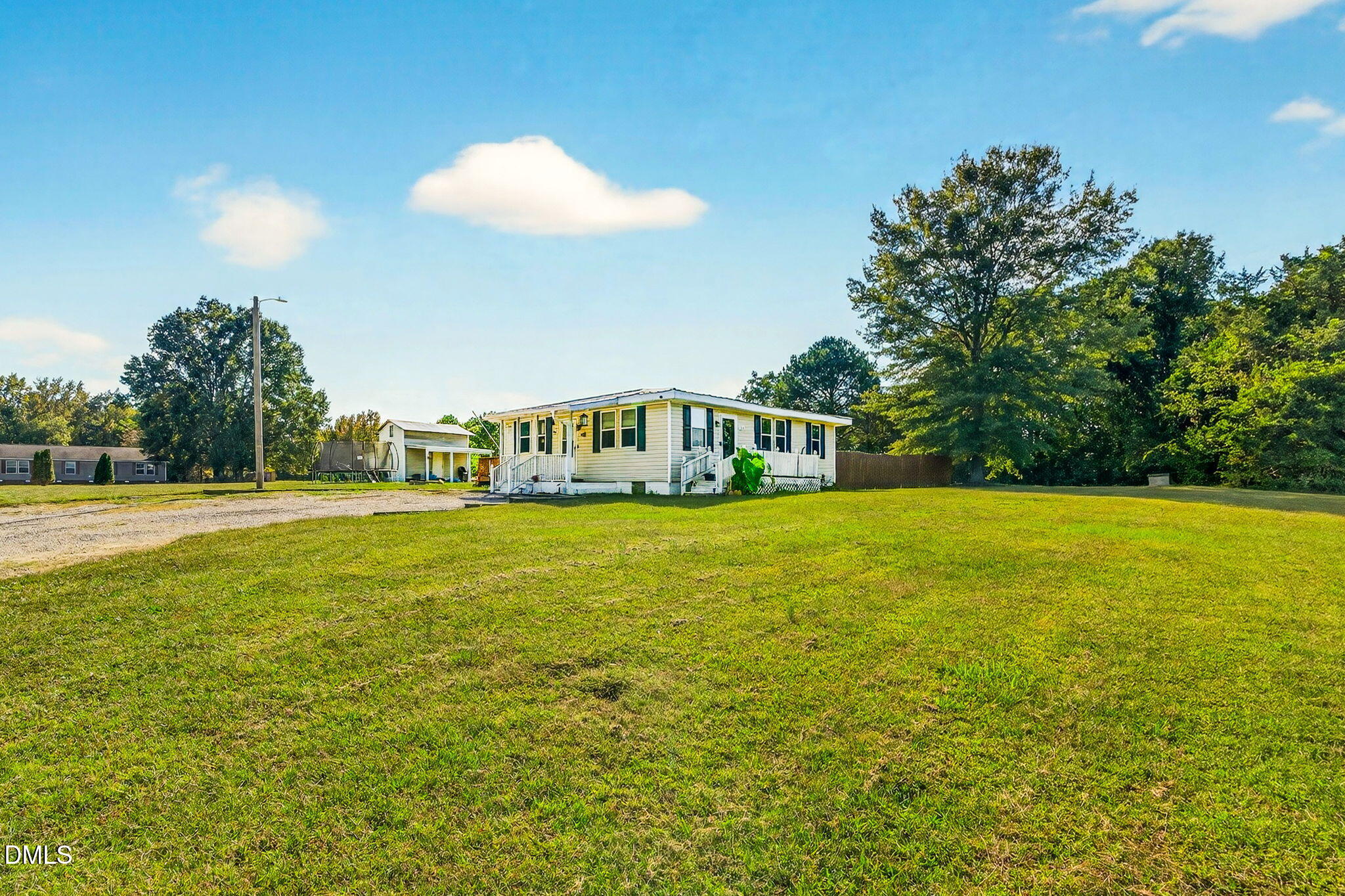 334 Perry Curtis Road Zebulon, NC 27597 - Photo 2 of 38 a view of a swimming pool with an outdoor space and seating area