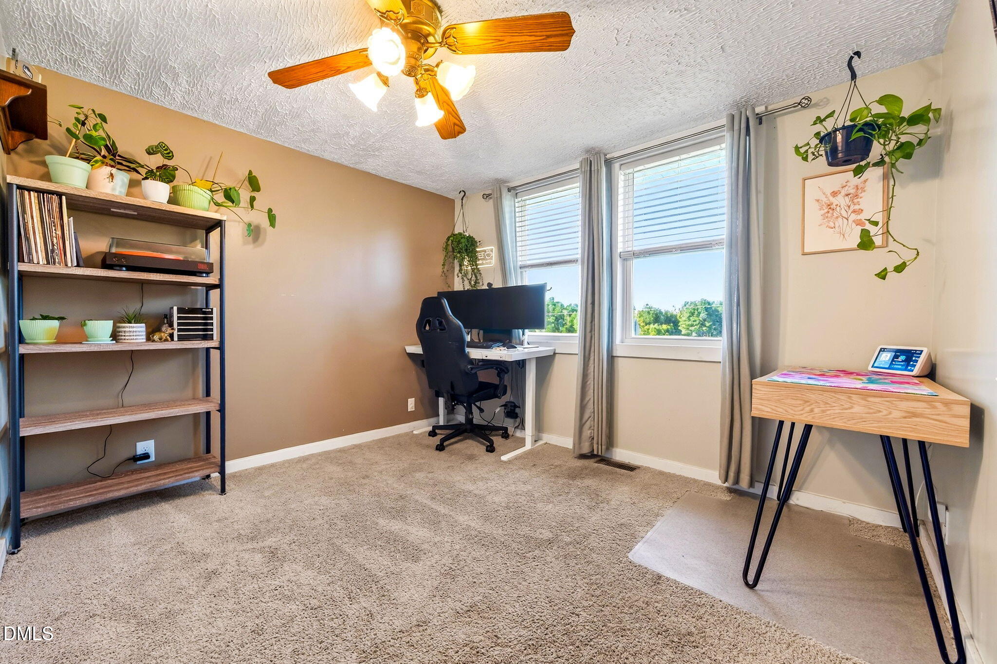 334 Perry Curtis Road Zebulon, NC 27597 - Photo 21 of 38 a view of a workspace with furniture and a window